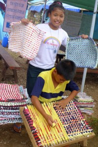 Children in Indahag learning to weave rugs.